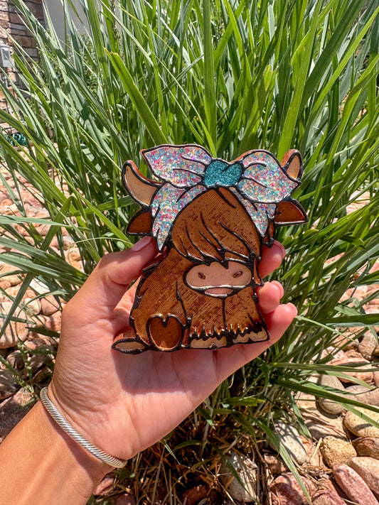 Highland with bow